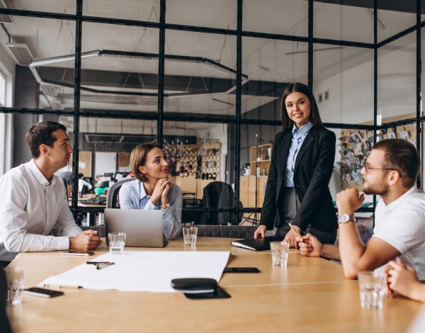 Group of people working out business plan in an office